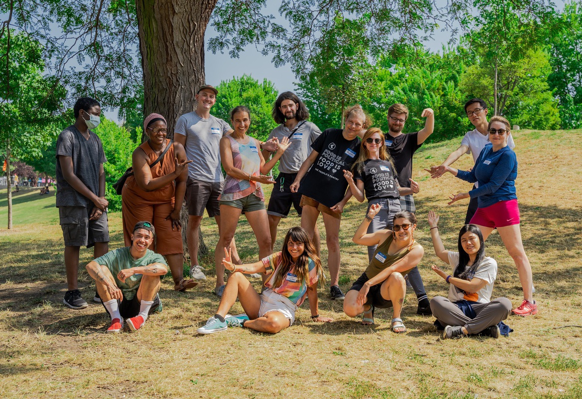Photo of our volunteers gathered in a park.